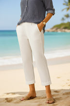 Damskie lniane spodnie capri relaxed fit z kieszeniami i mankietami